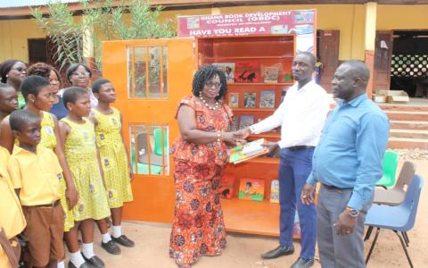  Shai Osudoku Municipal Director of Education a Book Booth stocked with assorted reading books 